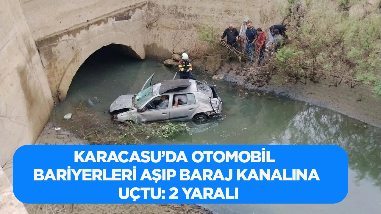 Karacasu&rsquo;da Otomobil Bariyerleri Aşıp Baraj Kanalına U&ccedil;tu: 2 Yaralı