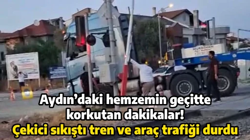 Aydın&rsquo;daki hemzemin ge&ccedil;itte korkutan dakikalar! &Ccedil;ekici sıkıştı tren ve ara&ccedil; trafiği durdu