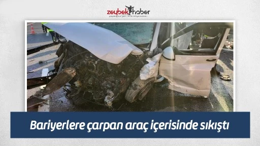 Bariyerlere &ccedil;arpan ara&ccedil; i&ccedil;erisinde sıkıştı