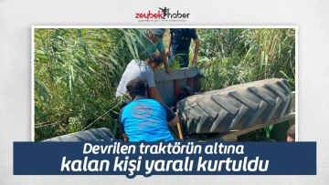 Devrilen trakt&ouml;r&uuml;n altına kalan kişi yaralı kurtuldu