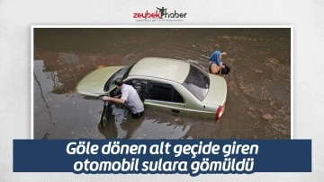 G&ouml;le d&ouml;nen alt ge&ccedil;ide giren otomobil sulara g&ouml;m&uuml;ld&uuml;