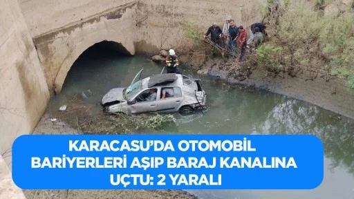 Karacasu&rsquo;da Otomobil Bariyerleri Aşıp Baraj Kanalına U&ccedil;tu: 2 Yaralı