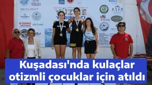 Kuşadası'nda kula&ccedil;lar otizmli &ccedil;ocuklar i&ccedil;in atıldı