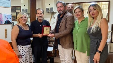 S&ouml;ke'de usta berber Casim &Ccedil;etinkaya'ya yılın ahisi onuru