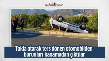 Takla atarak ters d&ouml;nen otomobilden burunları kanamadan &ccedil;ıktılar