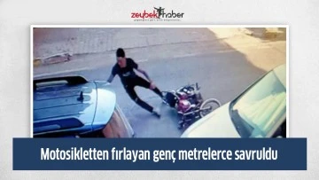 Yaklaşık 30 metre savrulan gen&ccedil; hi&ccedil;bir şey olmamış gibi kalkıp motosikletine koştu